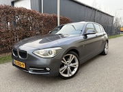 BMW 1-serie - 114i Business+ / SPORT / LEER / SCHUIFDAK / NAVI / STOELVERW
