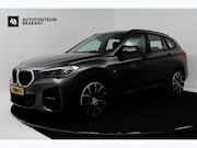 BMW X1 - sDrive18i High Executive (SFEERVERLICHTING, NAVIGATIE, CRUIS