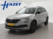 Skoda Karoq - 1.5 TSI ACT SPORTLINE + WEGKL. TREKHAAK | VOL LEDER | ADAPTI