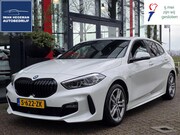 BMW 1-serie - 118i M-SPORT | Navigatie | Stoelen + Stuur verwarmbaar | Cru